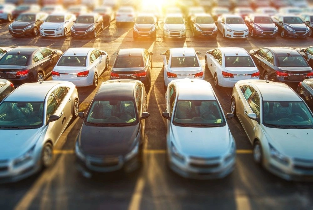 A bunch of cars parked in the lot