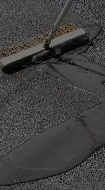 A gutter that is leaking water on the ground.